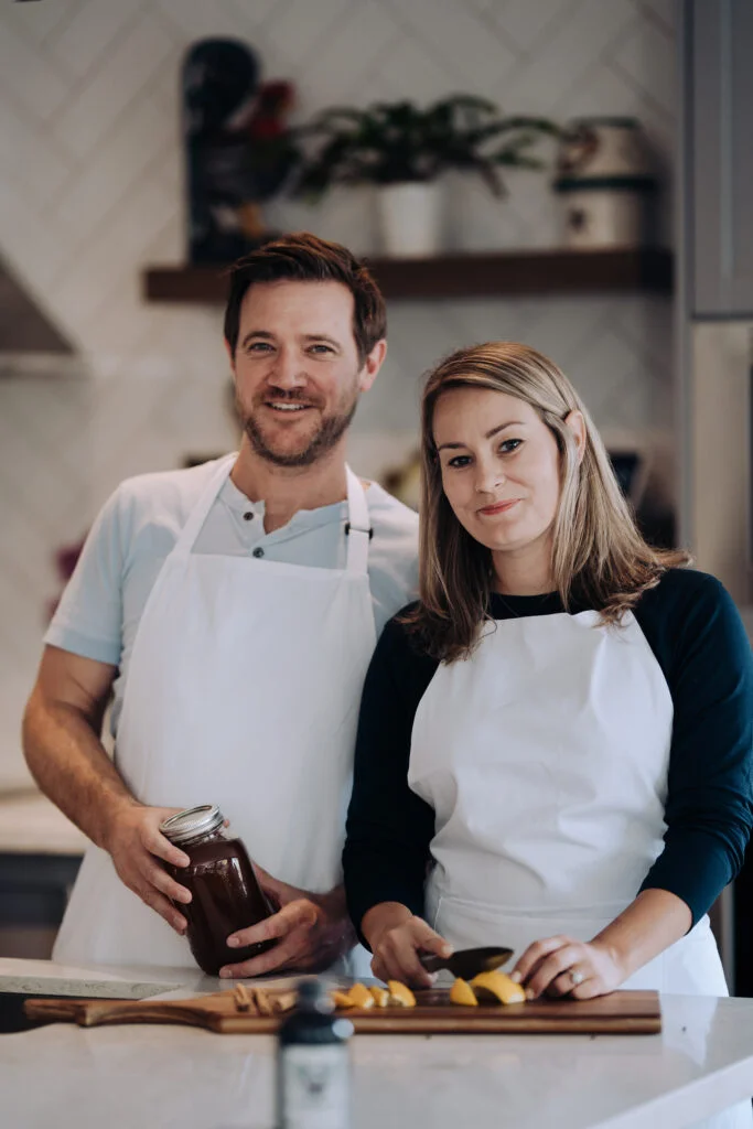 Justin and Staci in the kitchen with their elderberry syrup